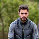 Ritratto professionale di Luca Moretti, fotografo naturalista, con la sua macchina fotografica